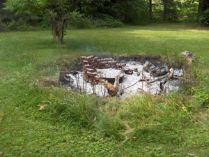 A crater where the fire pit used to be